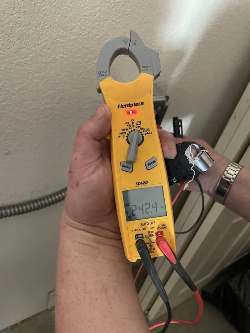 Voltage testing with clamp meter during Electrical Installation Services in Mono Vista